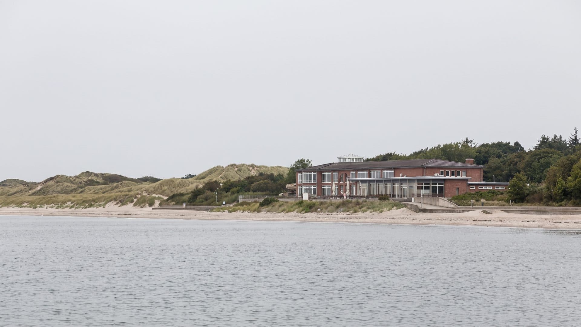The Aquafoehr baths seen across the water with the dunes behind