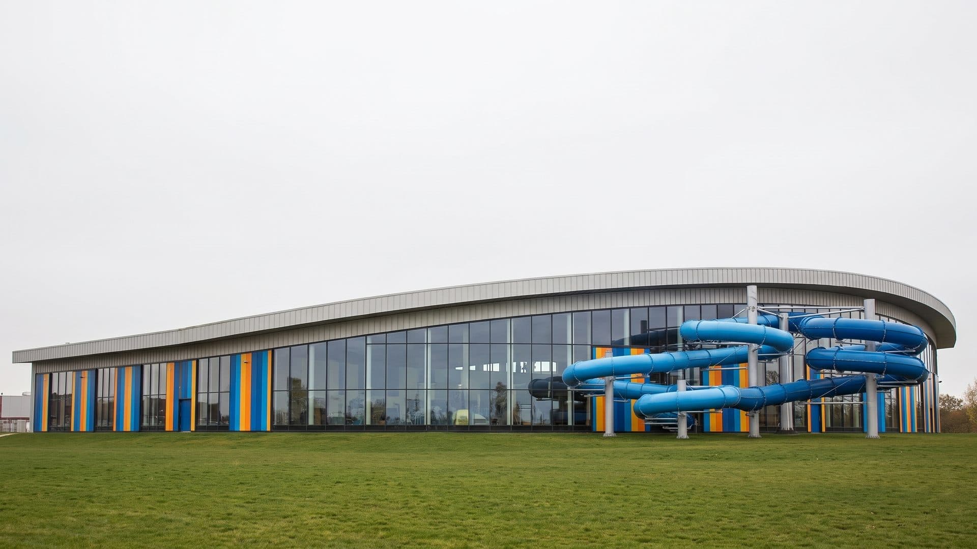 The water park in Kutno with its coloured slide tubes along the long glazed front
