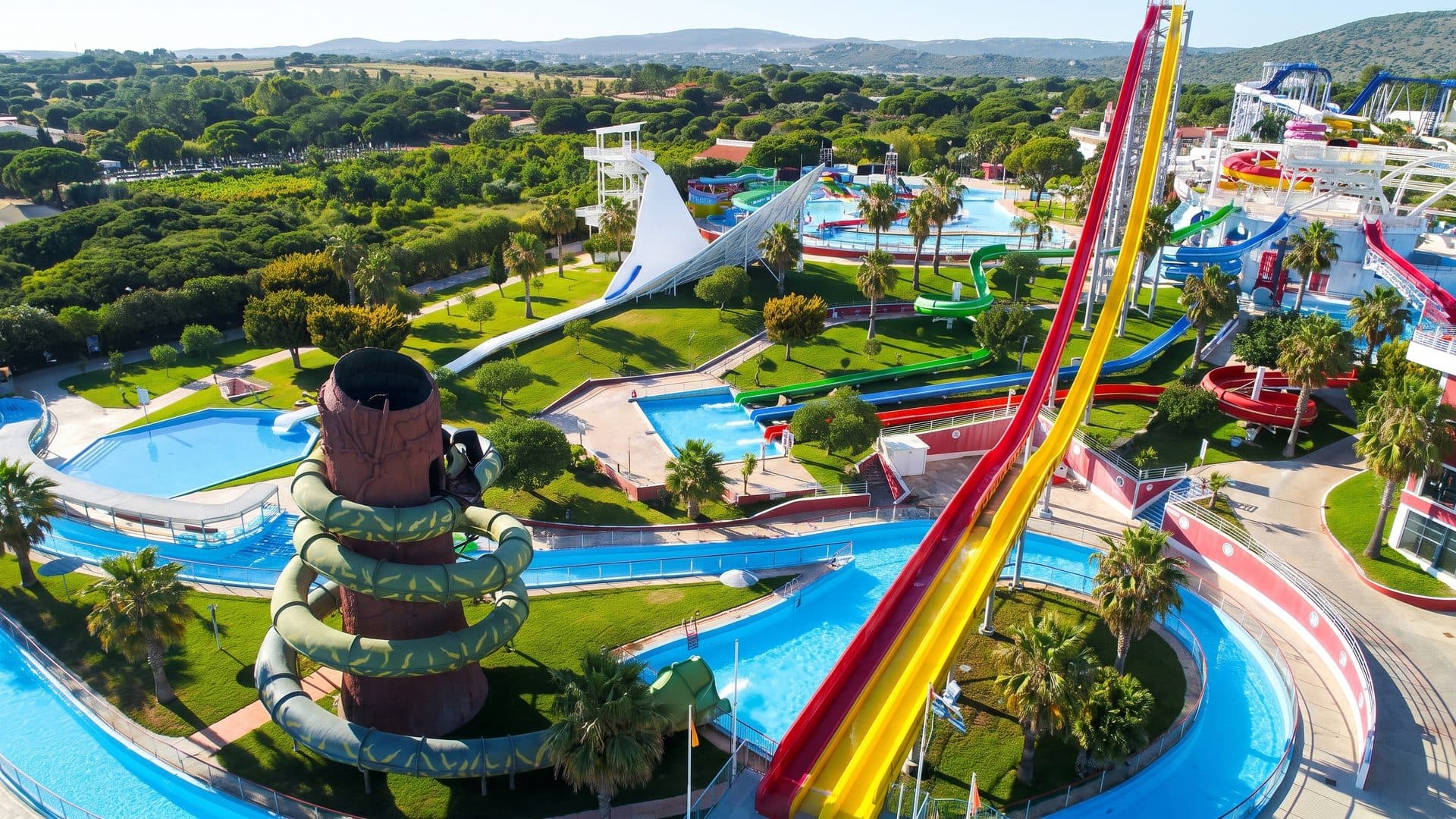 Aquashow Family Park from the air with its slides and pools among the lawns