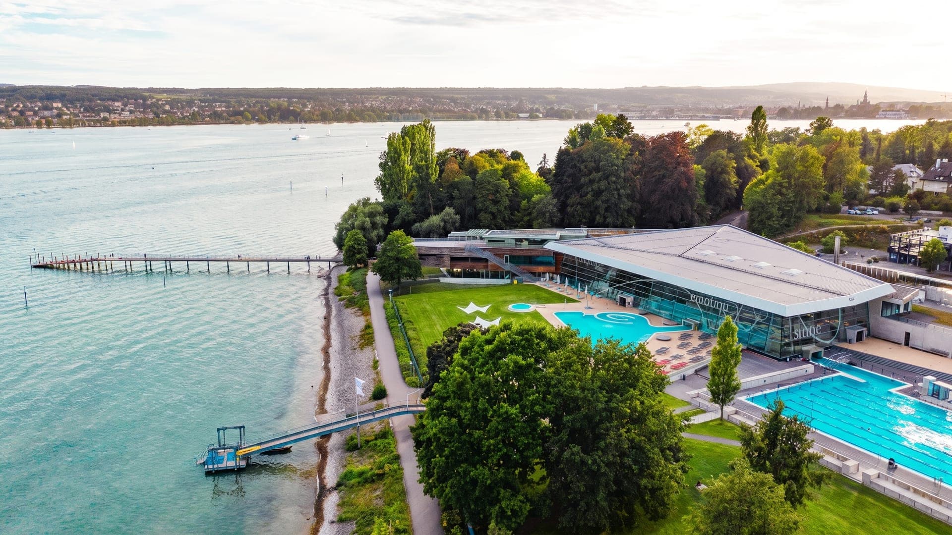 Aerial view of the bath on the lakeshore, with a jetty and outdoor pools