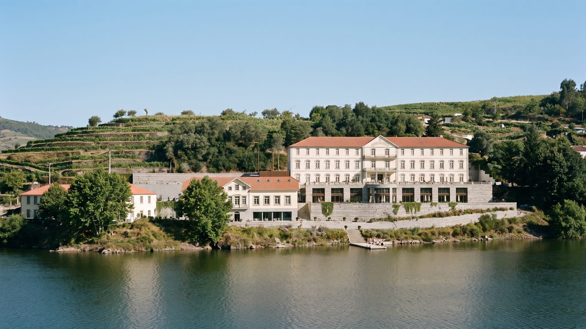 The spa building of Caldas de Canavezes on the bank of the Tâmega below its terraced hillside