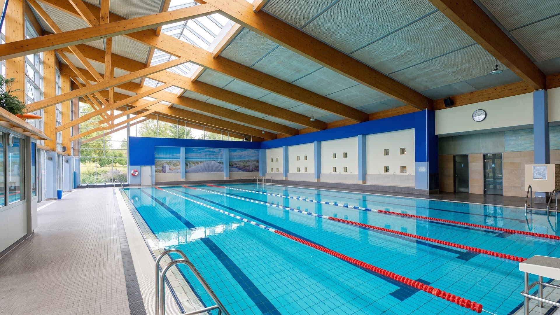 The twenty-five metre pool of the Winsen leisure baths under its timber roof trusses
