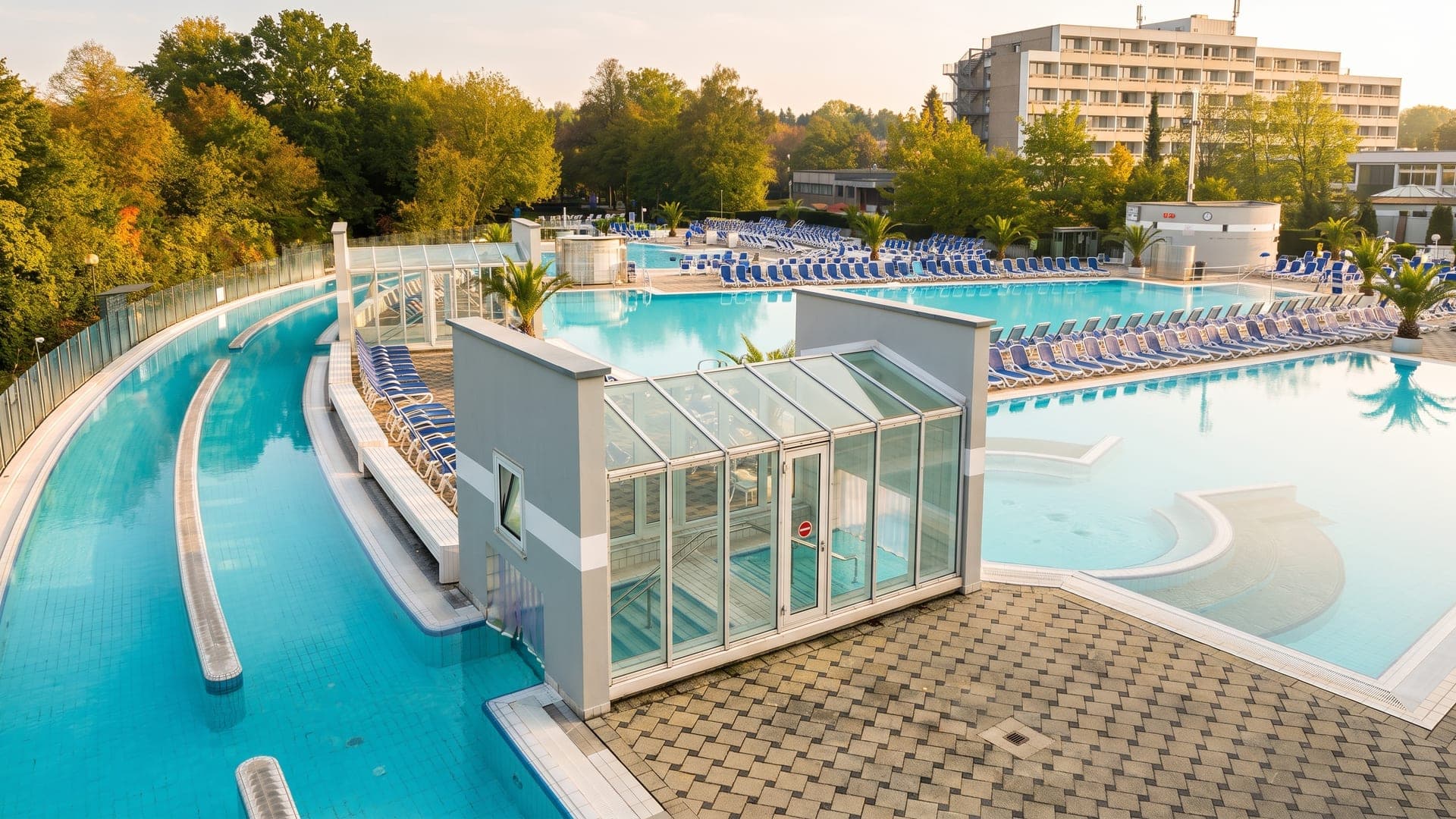 The curving outdoor pool at the Europa Therme in Bad Fuessing, wrapping around a small glazed pavilion.