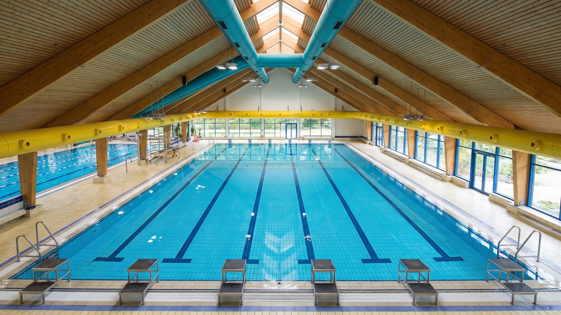 The lane pool of H2Oh! stretching down the hall under its timber roof