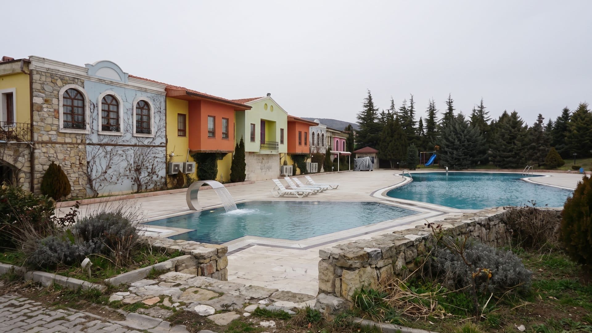 The outdoor thermal pool at the Hudai springs near Sandikli, ringed by its stone buildings
