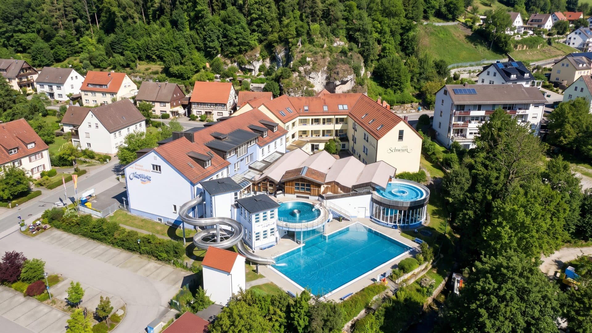 The Juramar baths from the air with their pools among the village houses