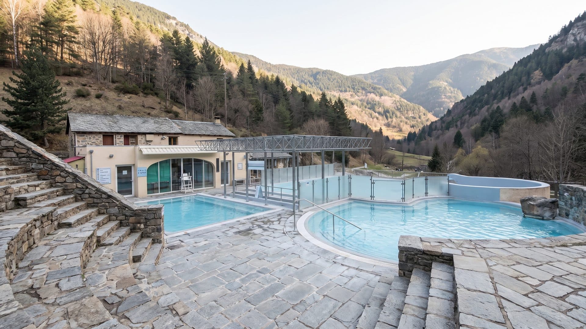 The mountain spa of Saint-Thomas with its outdoor thermal pool above the valley