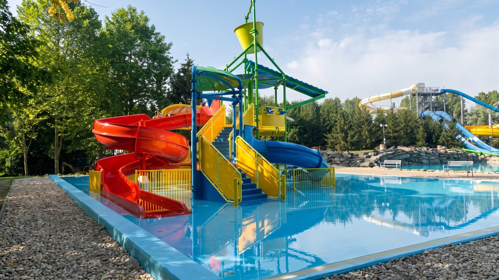 Children's slide structure standing in the shallow pool