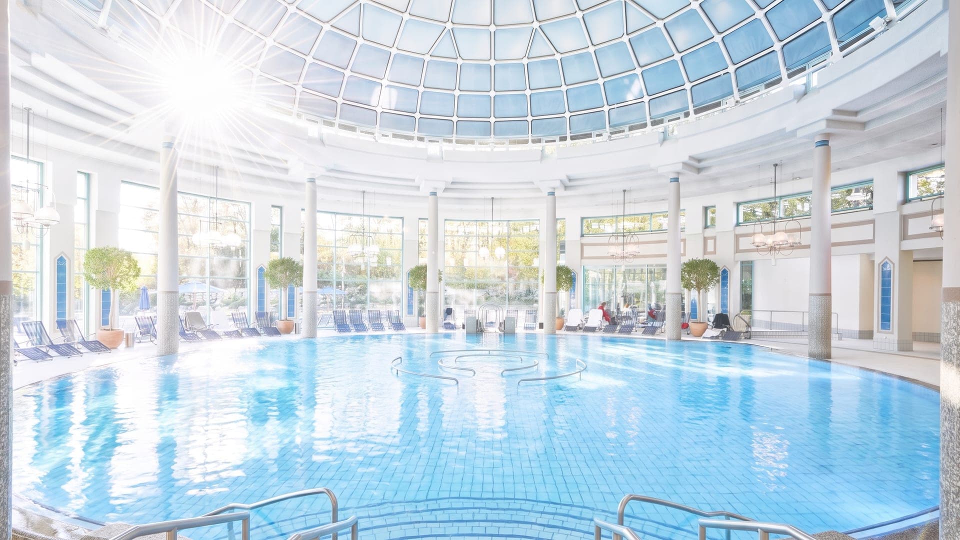 The glass rotunda of the Mineraltherme in Boeblingen, its columns and domed roof rising above the pool.