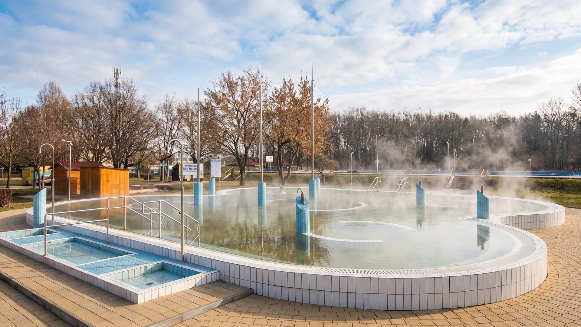 Steam rising from the outdoor thermal pool at the bath in Nagykata on a winter day.