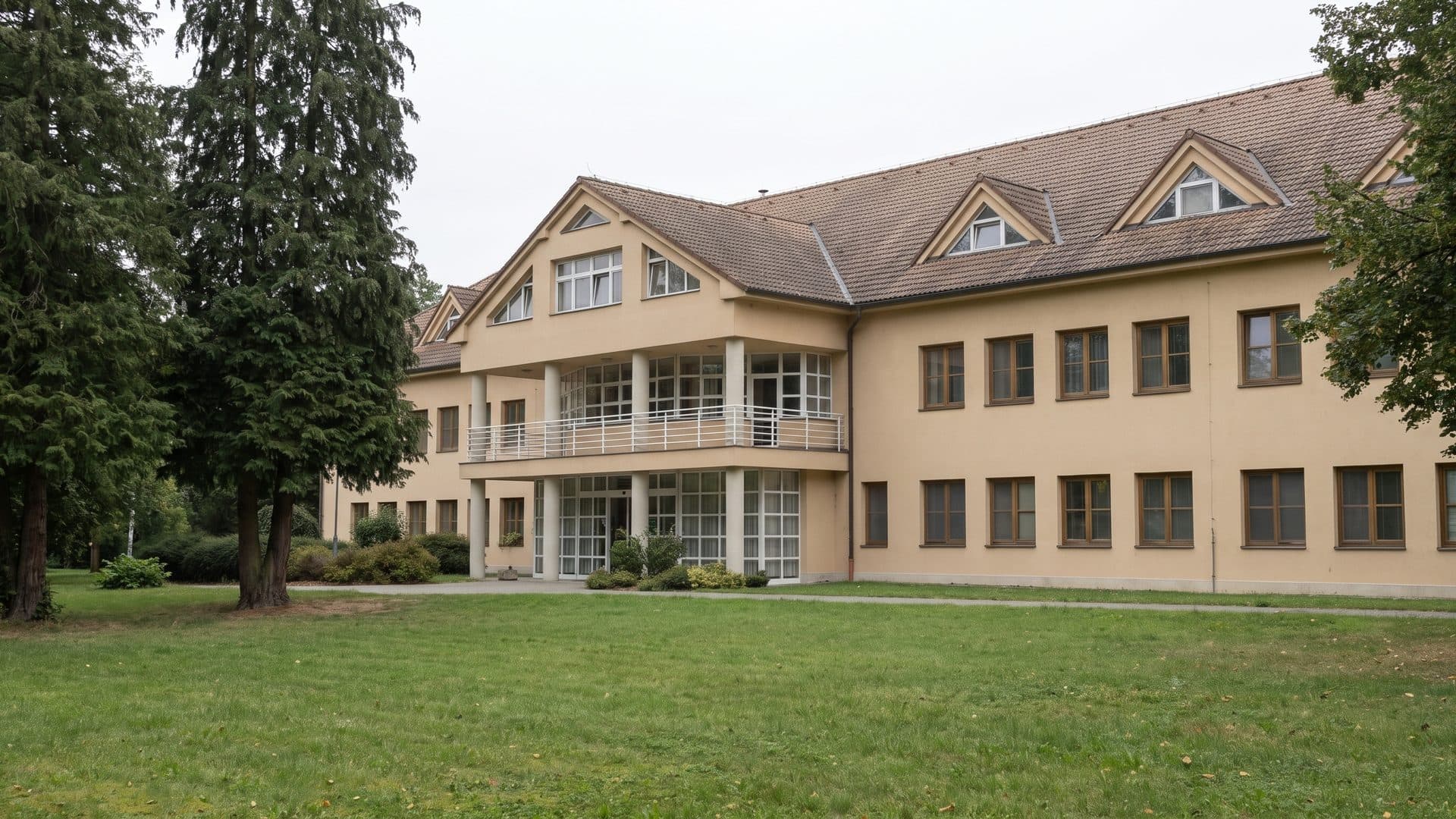 The spa house of the Ostrozska Nova Ves sulphur baths seen across its park