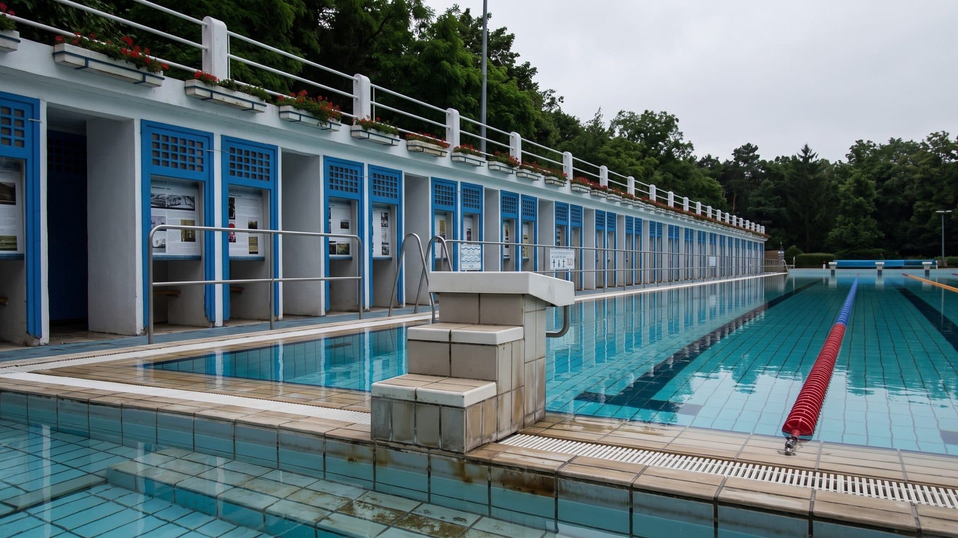 The lane pool of the Szent Istvan baths in Esztergom alongside the blue-framed row of changing cabins
