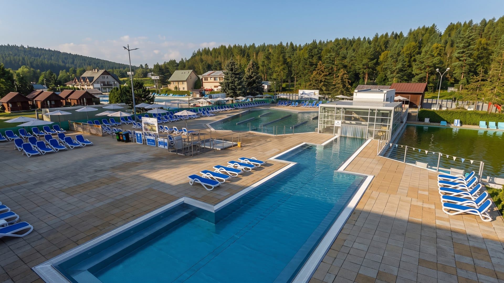 The terraced thermal pools at Vrbov with the bath buildings and hills behind