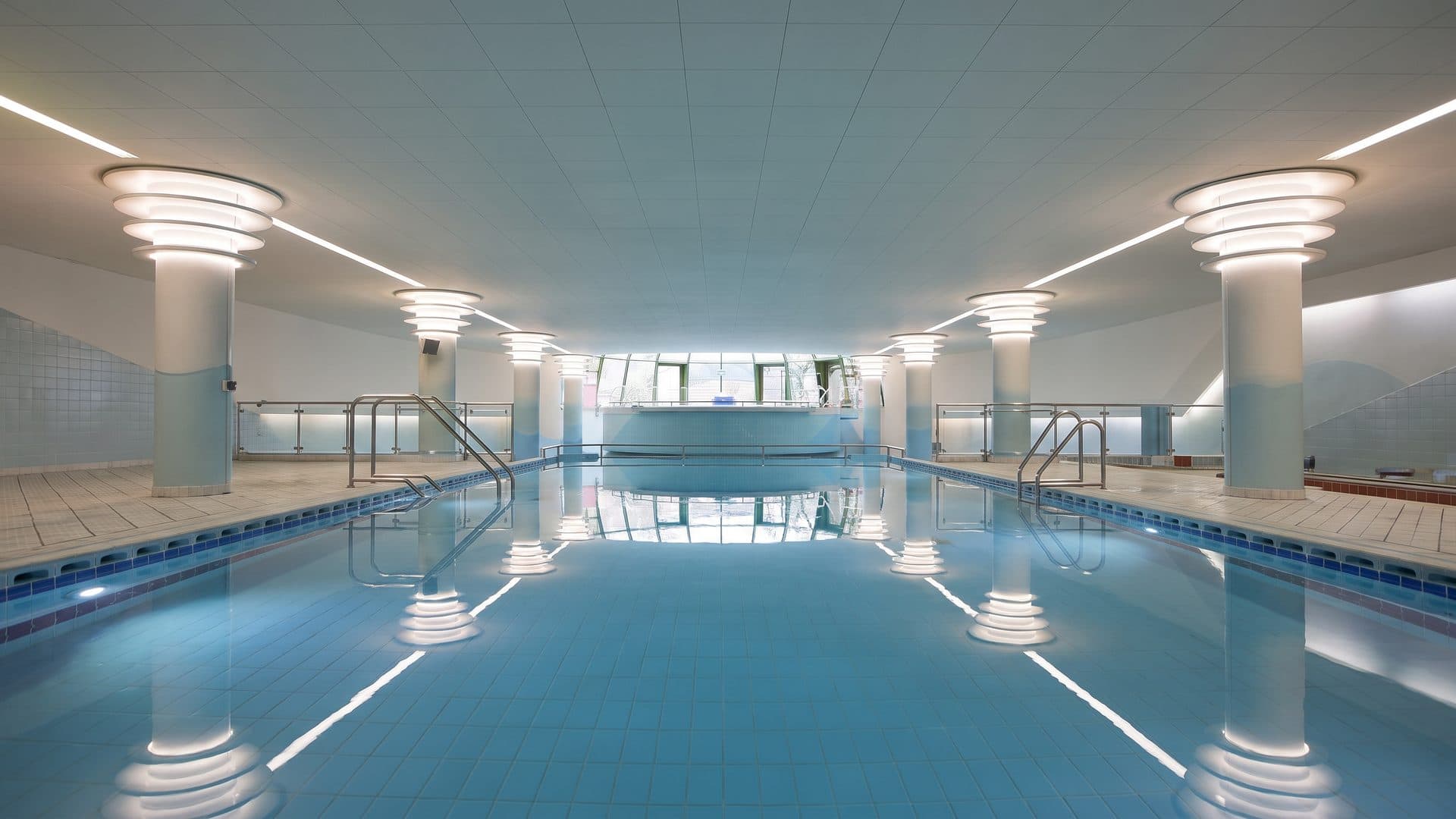 The indoor lane pool of Terme Felsinee under its round ceiling lights