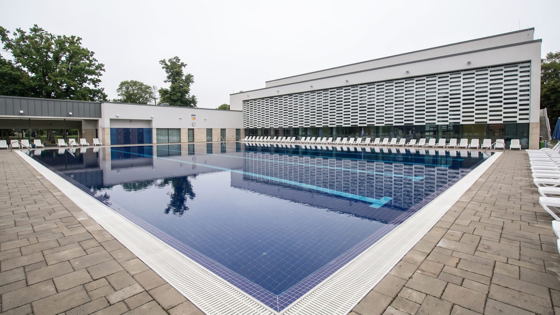 The outdoor pool at Thermal Spa Siklos beside the long low bath building.