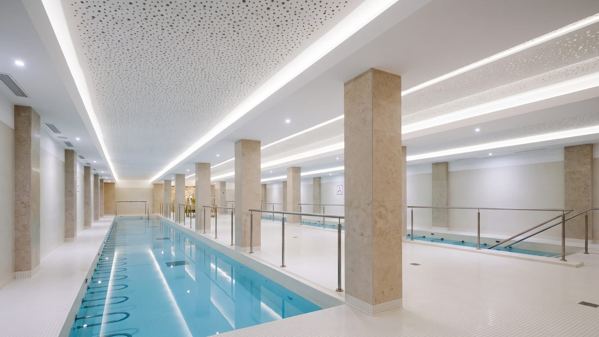 The pale pool corridor of the Greoux-les-Bains baths between its columns