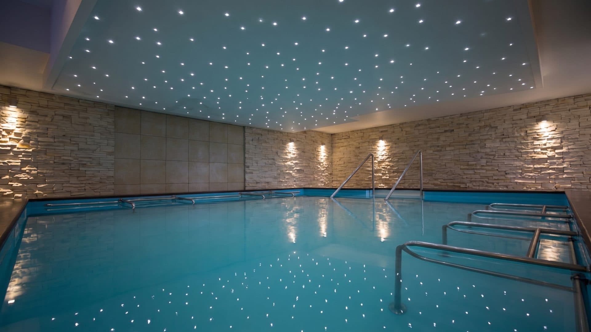 The pool of the Marlioz baths under its star-lit ceiling