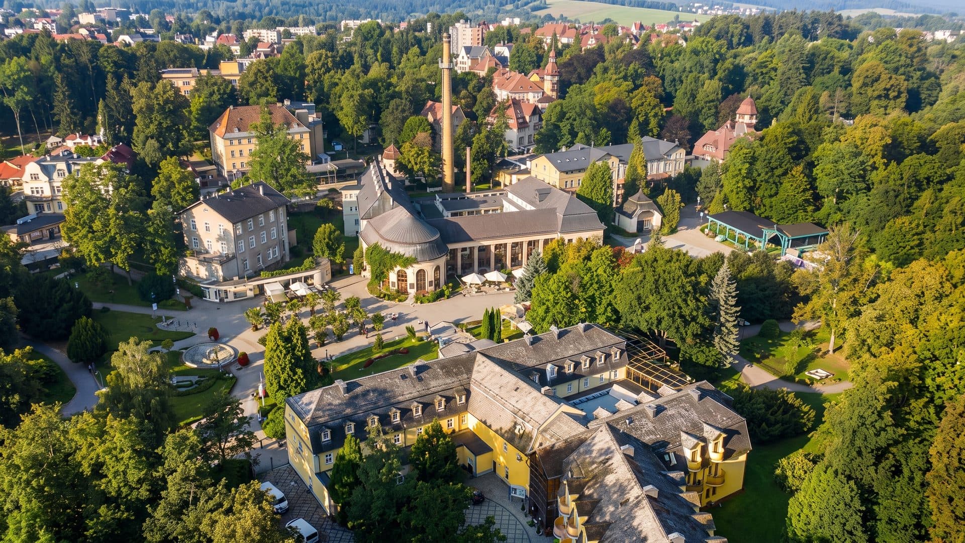 The spa park of Polanica-Zdroj from the air with its pump room among the trees