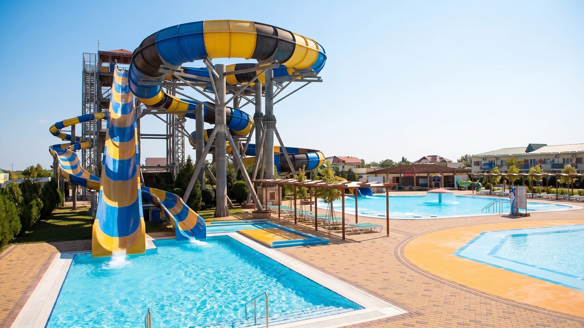 The slide tower of the Zolotoy Plyazh water park above its pools and deck