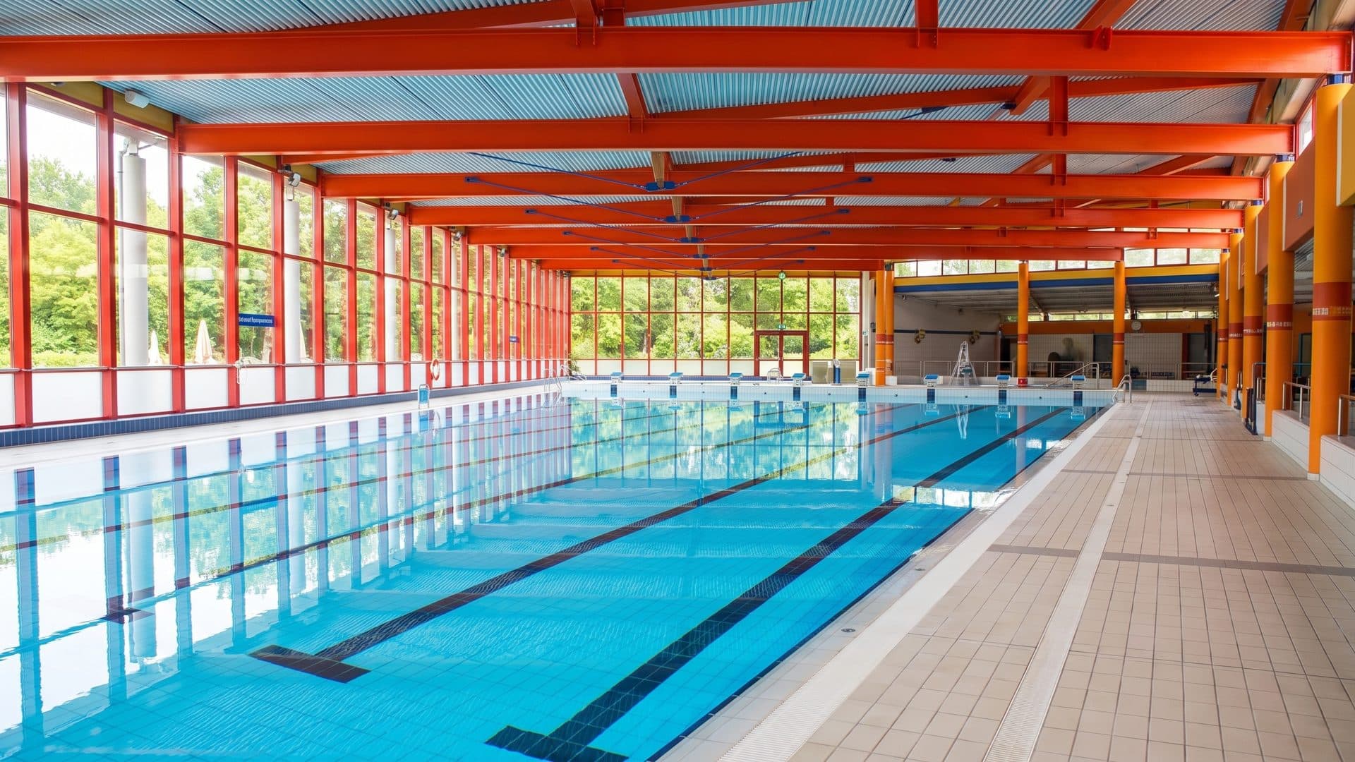 The pool of the Nautilla below the orange steelwork of its hall