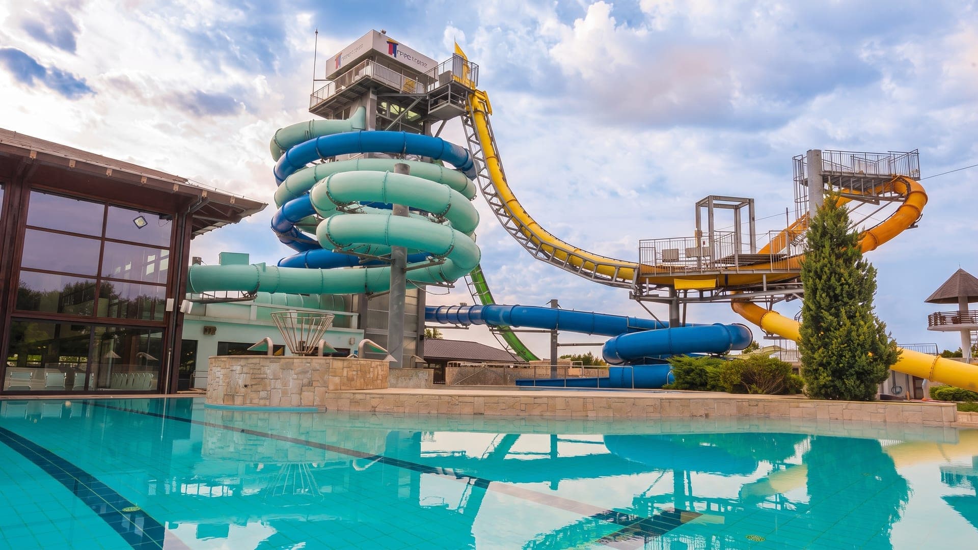 The waterslides at Terme 3000 in Moravske Toplice, their coils above the outdoor pool.
