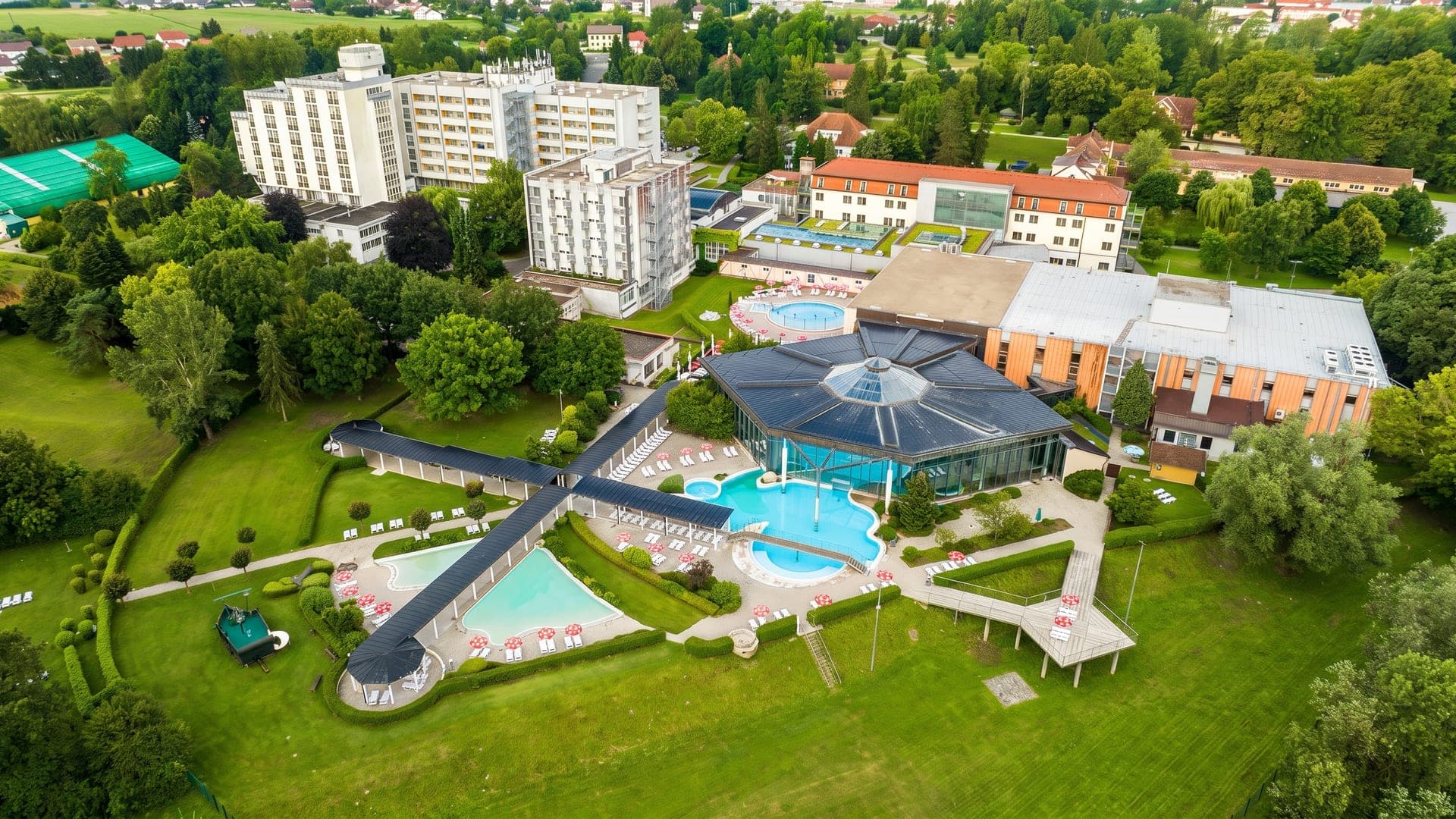 The Radenci spa seen from the air, its domed pavilion and pools set in the park among trees.